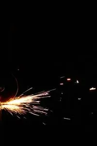 Flashing Sparks Coming From the Angle Grinder phone wallpaper background