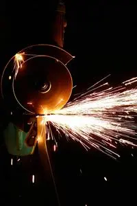 Flashing Sparks Coming From the Angle Grinder phone wallpaper background