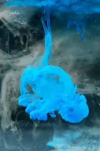 High Speed Photography of Blue Ink Diffusion in Water phone wallpaper background