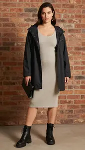 Confident Woman In Jersey Knit Dress Stock Photo