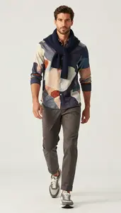 Man In Mid 20s Man Wearing Abstract Print Button Down And Chinos