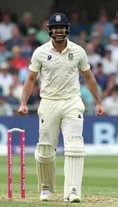 Cricket All Rounder In White Kit Celebrating A Wicket Joyful