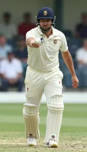 Cricket Bowler In White Kit Appealing After Delivering The