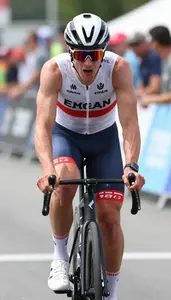 Cyclist In Sleeveless Racing Kit Crossing Finish Line