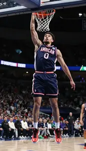 Energetic Basketball Player In Sleeveless Jersey And High