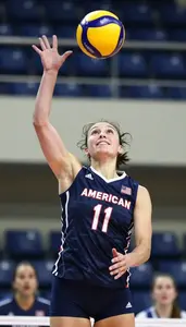 Energetic Volleyball Player In Sleeveless Top Jumping High