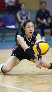 Indoor Volleyball Libero In Fitted Jersey Sliding Across