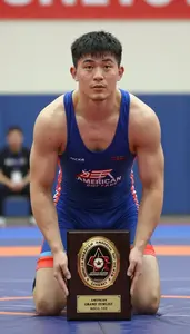 Indoor Wrestling Grand Finalist In Snug Singlet Lifting A