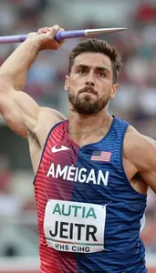 Javelin Athlete In Sleeveless Jersey Mid Throw Intense Face
