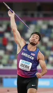 Javelin Thrower In Sleeveless Athletic Top Releasing Spear