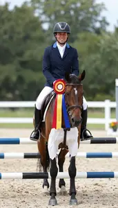 Open Countryside Equestrian Event Winner In Riding Attire