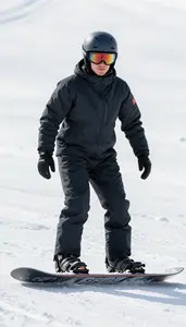 Snowboard Cross Athlete In Insulated Suit Racing Down A