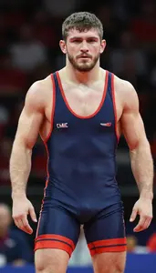 Wrestler In Competition Singlet Standing Ready Intense Face