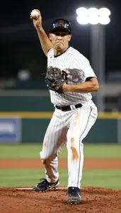 Baseball Pitcher In Pinstriped Uniform And Dirt Stained