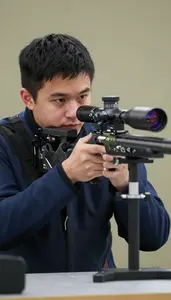 Benchrest Shooter In Heavy Coat And Specialized Rest