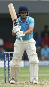 Cricket Batsman Without Helmet Wearing Cricket Shoes