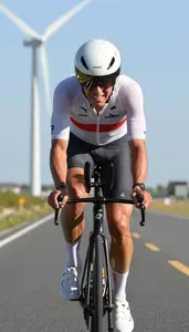 Cyclist In A Time Trial Suit And Aero Helmet Helmet On