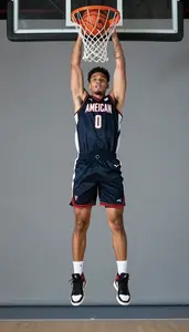 Energetic Basketball Player In Sleeveless Jersey And High