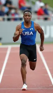 Full Body Photo Of A Sprinter In Fitted Blue Singlet And