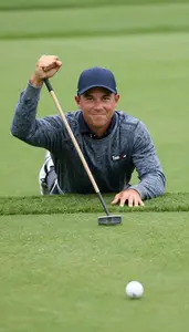 Golfer In A Sweater And Cap Sinks A Long Putt Fist Pump Face