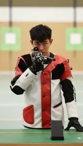 High Power Rifle Shooter In Shooting Coat And Sling Position