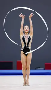 Indoor Gym Rhythmic Gymnast In Elegant Performance Outfit