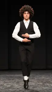 Irish Dancer In Hard Shoes And Curly Wig Maintaining Rigid