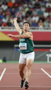 Javelin Thrower In A Dark Green Vest And White Briefs Grips