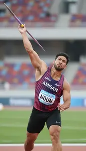 Javelin Thrower In Sleeveless Jersey Releasing The Spear On