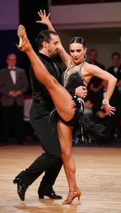 Jive Dancer In Energetic Style And High Kicks Dancing With A