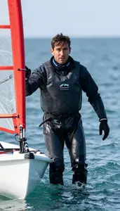 Open Coastal Regatta Sailor In Waterproof Jacket Hiking Out