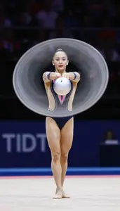 Rhythmic Gymnastics Ball Specialist Wearing Leotard Focused
