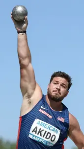 Shot Putter In Sleeveless Top And Glide Technique Releasing