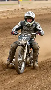 Speedway Rider In Steel Shoe And Leathers Sliding The Bike