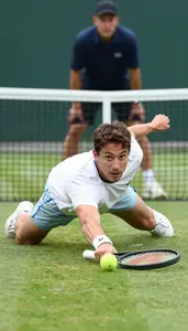 A Tennis Player Changes Direction Mid Point Sliding On A