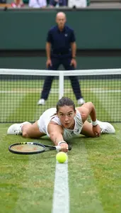 Tennis Player Changes Direction Mid Point Sliding On A Grass