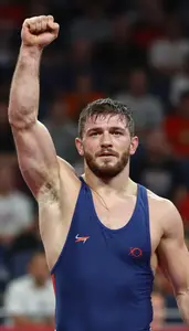 Wrestler Standing Victorious With Raised Arm Proud Face