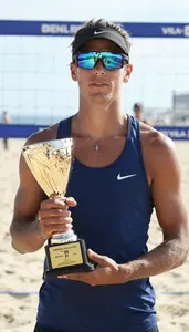 Beach Volleyball Spiker Wearing Top Showcasing Clutching