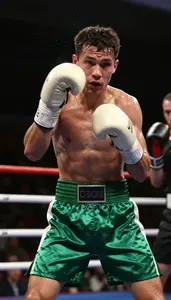 Boxer In Forest Green Satin Shorts And Cream Hand Wraps
