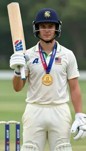 Cricket Tail Ender Wearing Arm Guard Standing Triumphantly