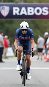 Cyclist In Fitted Racing Suit Sprinting Toward The Finish