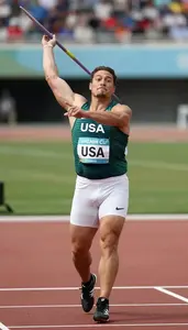 Javelin Thrower In A Dark Green Vest And White Briefs Grips
