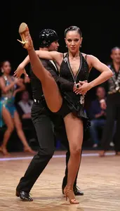 Jive Dancer In Energetic Style And High Kicks Dancing With A