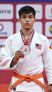 Judo Judoka Wearing Orange Belt Displaying Awarded Silver