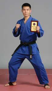 Wushu Sanda Fighter Wearing Silk Shoes Standing Triumphantly