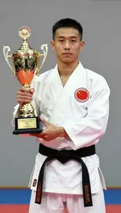 Wushu Wing Chun Practitioner Wearing Sash Standing In Honor