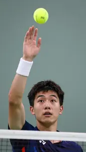 Badminton Doubles Player Wearing Wristband Alert Clearing