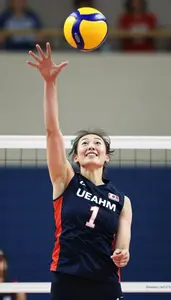 Energetic Volleyball Player In Sleeveless Top Jumping High
