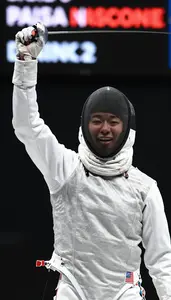 Fencer Celebrates A Point Mask In Hand Face Alight With Joy
