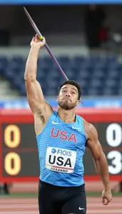 Javelin Thrower In A Light Blue Vest Walks Off The Field